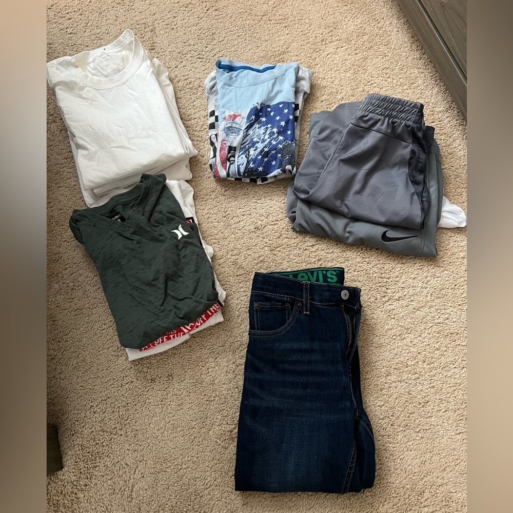 Bundle of shirts and short and jeans
